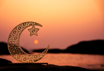Crescent moon shape during sunset , 2024 Islamic concept image, Eid Mubarak greeting background