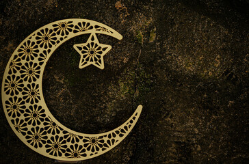 Crescent moon shape on the rock textured background, 2024 Eid Mubarak concept image, golden moon,...
