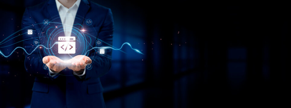 Businessman holding virtual Web Development Network Connection Icons. Coding, Designing, Connectivity - Powering Internet Business and Social Network.