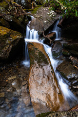 Scenic water stream running through the rocks