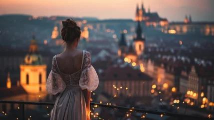 Foto op Aluminium A graceful lady standing with a view of historic buildings in the city of Prague, Czech Republic in Europe. © Joyce
