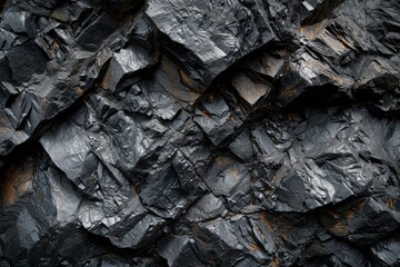 The rugged texture of coal with hints of rust offers a glimpse into Earth's ancient natural resources, frozen in time yet full of energy.