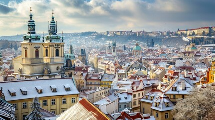 Fototapeta premium Beautiful historical buildings in winter with snow and fog in Prague city in Czech Republic in Europe.