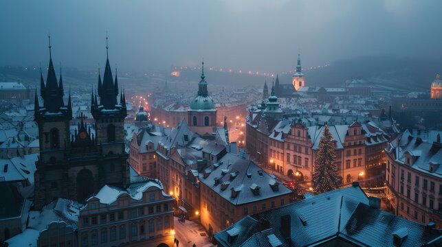 Beautiful historical buildings in winter with snow and fog in Prague city in Czech Republic in Europe. © Joyce