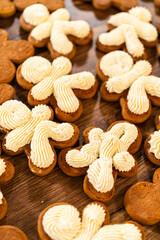 Making Festive Gingerbread Sandwiches on Rustic Wooden Table