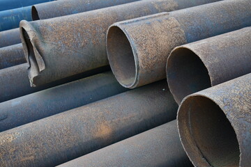 Pile of new iron water pipes.