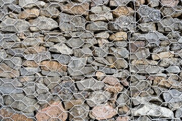 Textured Background Gabion Rock Wall With Wire Meshed Fence