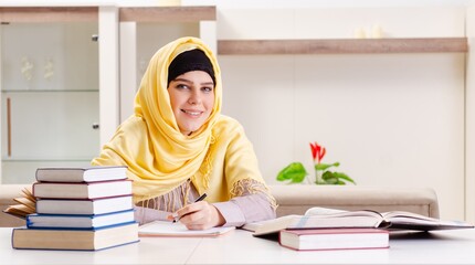 Female student in hijab preparing for exams