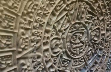 Ancient Mayan Calendar or Aztec calendar with rough relief surface outdoors