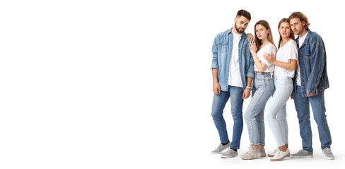 Stylish young people in jeans clothes on white background with space for text