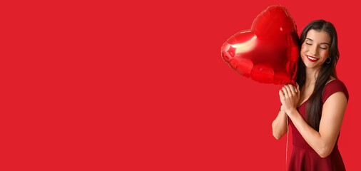 Beautiful young woman with kiss marks on her face and heart shaped air balloon on red background with space for text