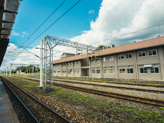 Train tracks and blue sky with white clouds