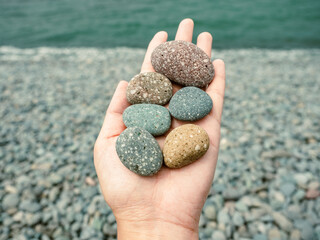 Pebbles stacked in the seaside. background.
