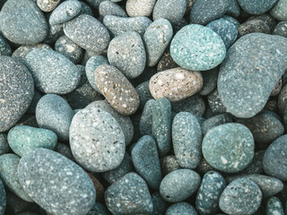 Pebbles stacked in the seaside. background.