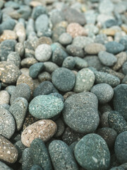 Pebbles stacked in the seaside. background.