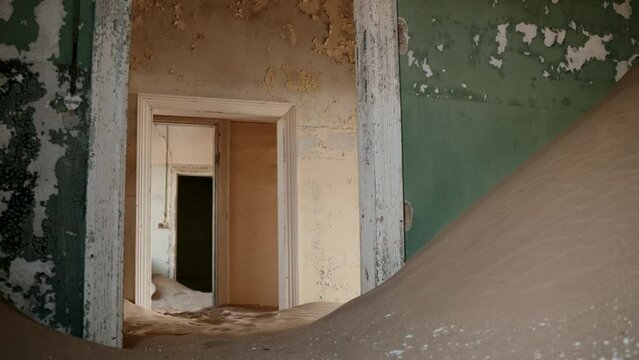 Colorful empty hallways filled with desert sand.