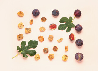 Sweet dried figs and fresh fruits on orange background