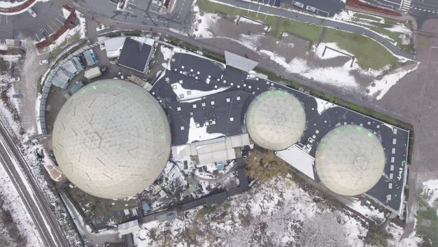 Glass Rainforest Domes In Winter At Randers Regnskov Tropical Zoo In Randers, Denmark. aerial topdown shot