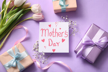 Card with text MOTHER'S DAY, gift boxes and beautiful flowers on purple background - Powered by Adobe