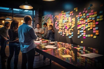 Foto op Canvas Creative Team Brainstorming Session with Sticky Notes. A group of professionals engaging in a collaborative brainstorming process, surrounded by colorful sticky notes on a wall.   © banthita166