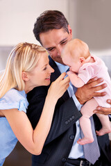 Couple, home and holding with love, baby and smile for morning, child and kitchen. Parents, child and toddler with family, relationship and routine for man, suit and house with daughter, mom and dad