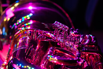  Close-up fragment of a bass tuba with stage light reflection - obrazy, fototapety, plakaty
