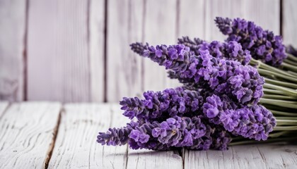 A bunch of purple flowers on a wooden table
