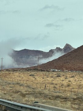 low lying clouds in northwest arizona road near the Grand Canyon