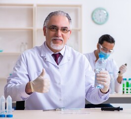 Two chemists working in the lab