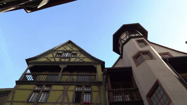 Maison Pfister house has a spiral staircase octagonal turret with a bulb crown. Paintings on the facade, credited to artist Christian Vacksterffer, depict Germanic emperors of the 16th century