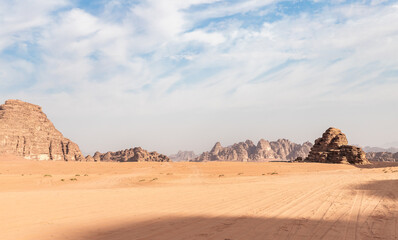 The unearthly beauty of the vast expanse of the endless sandy red desert of the Wadi Rum near Amman in Jordan