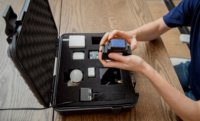 A technician works with a demo kit of the smart home system