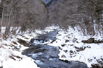 Fototapeta na wymiar 雪の川