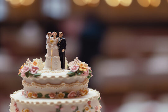 Polyamorous Wedding Featuring Throuple Cake Toppers