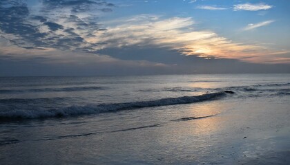 Fototapeta na wymiar calm ocean at dawn or sunset. Panoramic banner of a peaceful landscape
