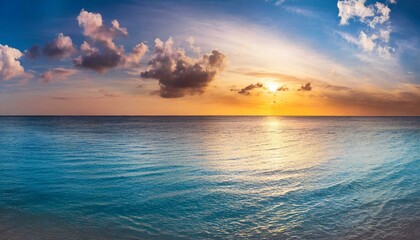 Fototapeta na wymiar sunset over the ocean, calm ocean at dawn or sunset. Panoramic banner of a peaceful landscape