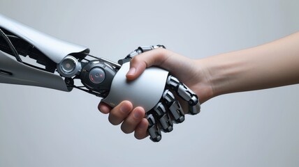 Human and robotic hands in a symbolic handshake