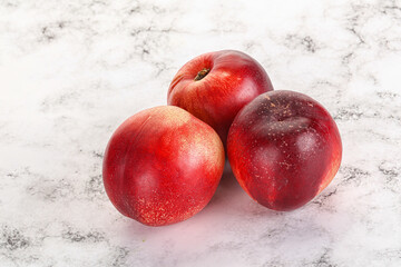 Ripe sweet juicy nectarines heap