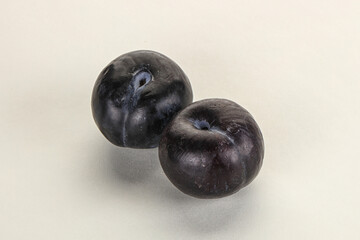 Two ripe sweet black plums