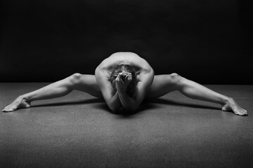 Abstract sport and medical concept. Beautiful body of yoga woman over dark background.	
