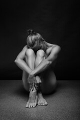 Abstract sport and medical concept. Beautiful body of yoga woman over dark background.	