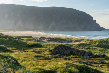 A serene summer evening by the Barents Sea. Beautiful and warm summer evening light on the...
