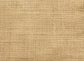 Jute hessian sackcloth canvas sack cloth woven texture pattern background in yellow beige cream brown color