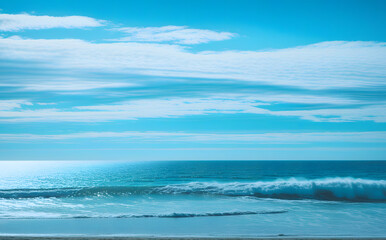 Fototapeta premium Sea of Tranquility: Gentle Ripples Under a Sky of Clouds