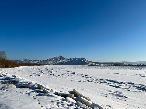 landscape with snow of Selenga river iced surface