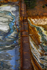 Acidic Waterway by Stone Wall in Rio Tinto, Huelva