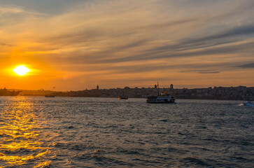 Fototapeta na wymiar ferry boats and Istanbul susnset view from Bosporus