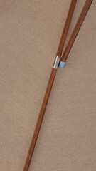 Close up low angle view of an opened beach fabric umbrella, view from under parasol, holiday or vacation concept, with copy space