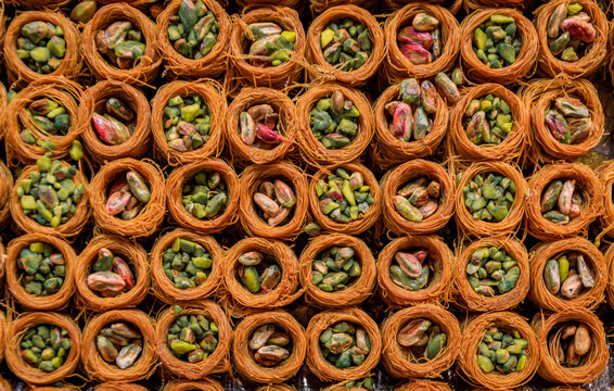 Traditional Turkish dessert, crispy borma baklava with pistachios, whole nuts rolled in fresh shredded kataifi dough dipped in syrup, Istanbul, Turkey