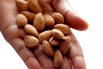 a bunch of almonds in a women  hand